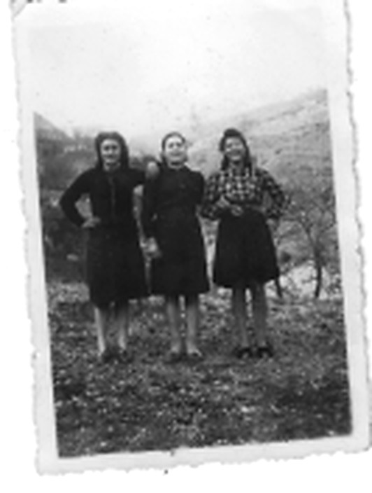 Flora as a young woman with two girlfriends