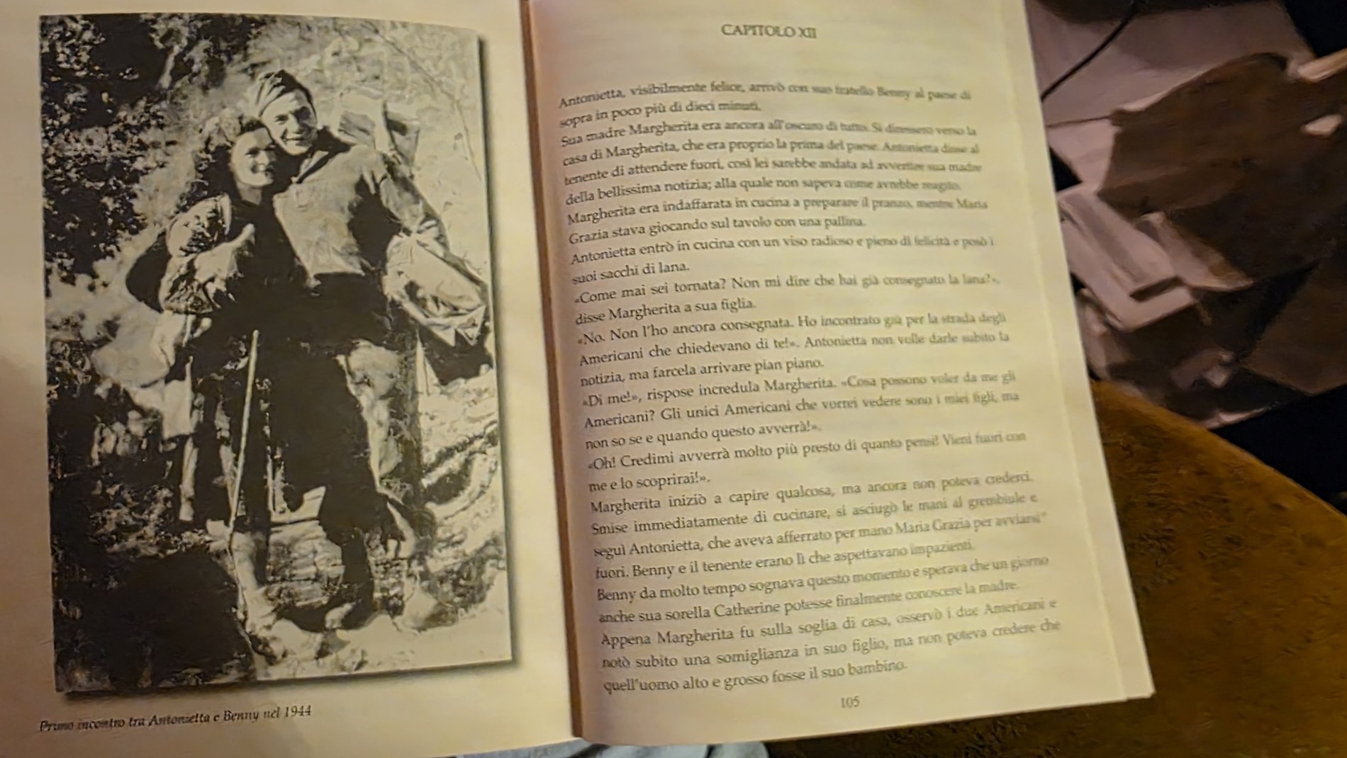 Open book showing the 1944 photograph of Antonietta and Benny meeting after years of separation