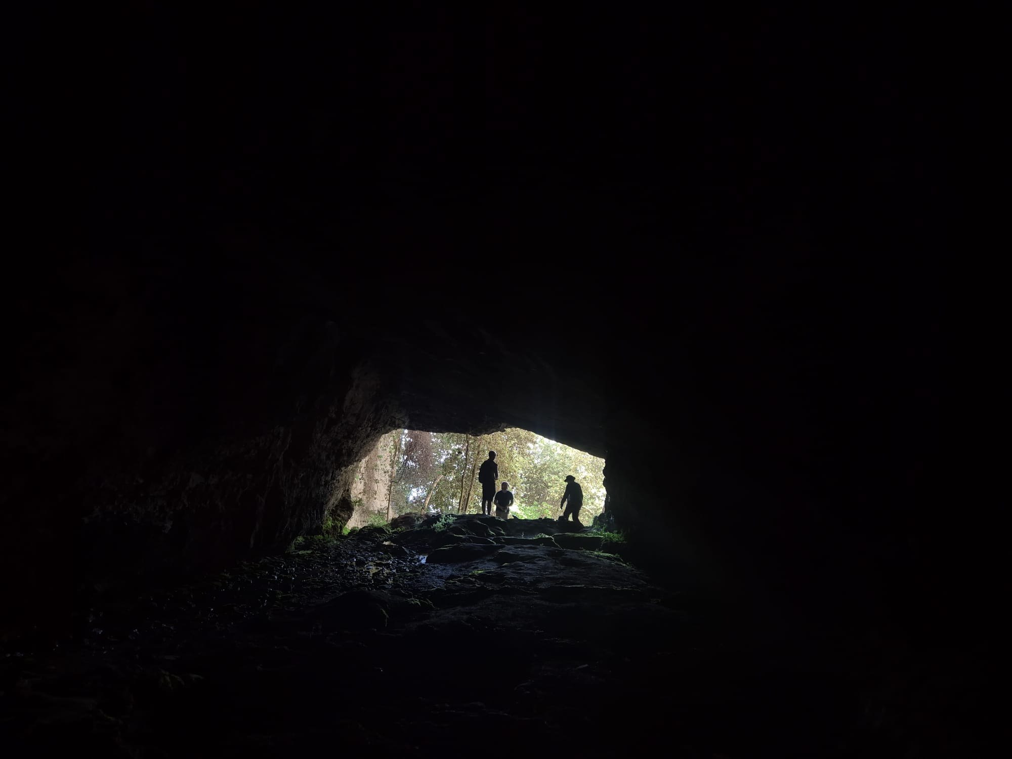 Inside the Cave of Cascaltendine looking toward figures at its entrance